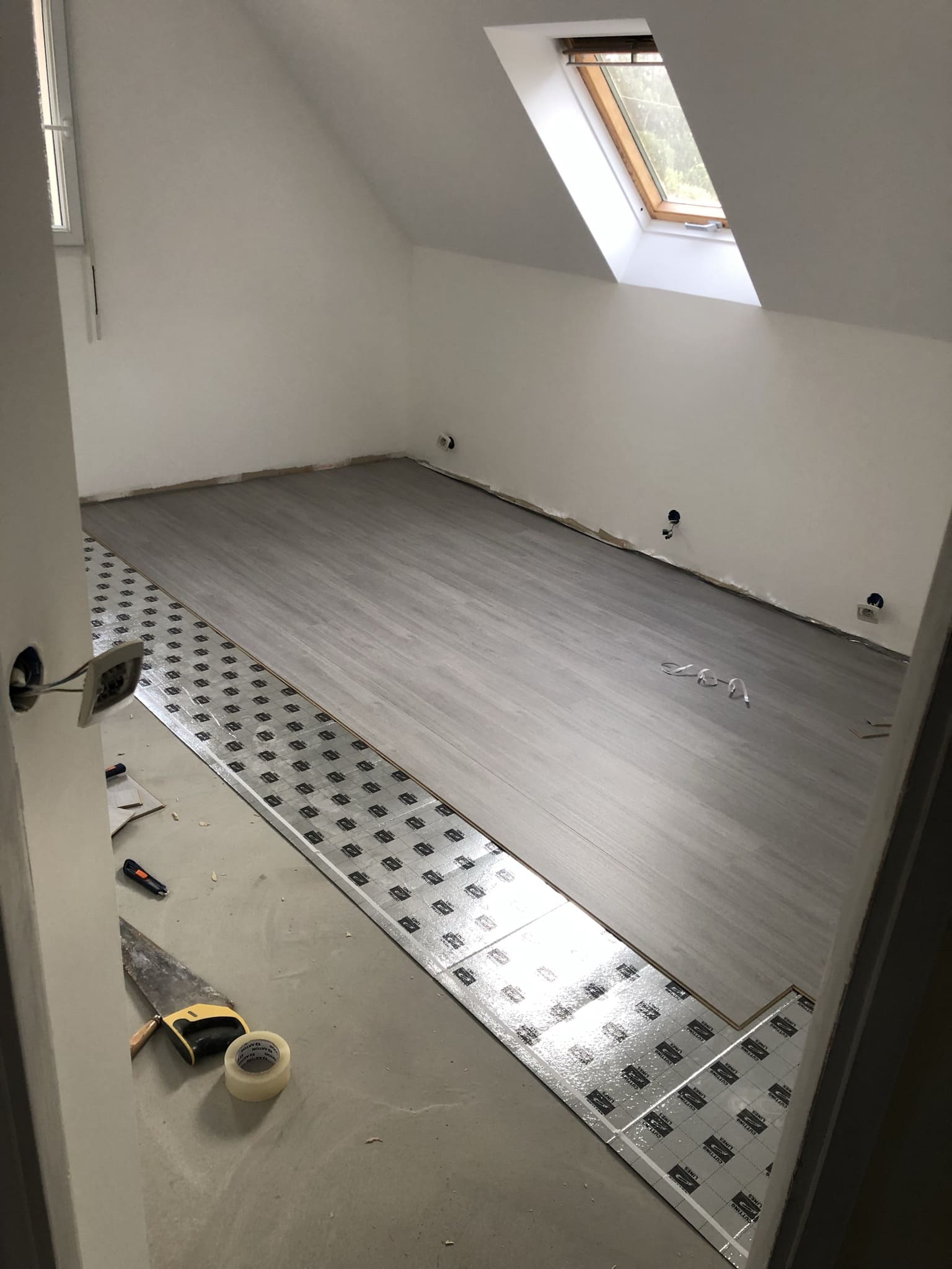 Pose parquet dans chambre